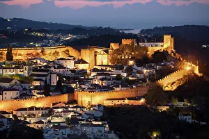 Fortified Wall Prints: View over the old town and walls of Obidos floodlit at night