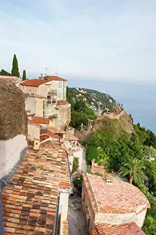 Southeast Prints: View of old village rooftops in Roquebrune-Cap-Martin with coastal scenery in the background