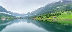 Fjord Prints: View of Olden village and mountains reflecting in Nordfjorden during summer