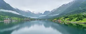 Olden Prints: View of Olden village and mountains reflecting in Nordfjorden during summer