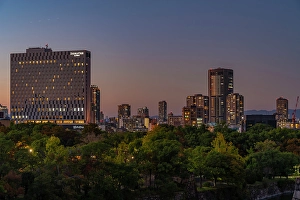 Osaka Prints: View of Osaka skyline from Osaka Castle at dusk, Chuo Ward, Osaka, Honshu, Japan