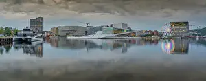 Public Spaces Prints: View of Oslo Opera House and Munch Museum reflecting in harbour on cloudy day