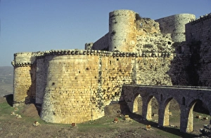 Crusader Prints: view from outside with towers moat and stone bridge