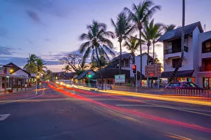 Light Trail Prints: View of palm trees and boutique shops in Grand Bay at dusk