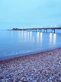 Enjoyment Prints: View of the pier at dusk with lights reflecting on the water in Deal Kent