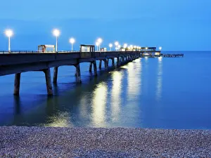 Long Prints: View of the pier at dusk with lights reflecting on the water in Deal Kent