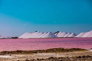 Salt Prints: View of the pink colored ocean overlooking the Salt Pyramids of Bonaire from afar