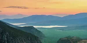 Flowing Water Gallery: View over the Pleistos River Valley towards the Gulf of Corinth at dusk, Delphi, Phocis, Greece