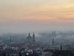 Bohemia Prints: View of Prague spires and towers in morning mist from Petrin Hill
