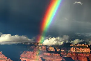Wonders Prints: View of a rainbow over Grand Canyon from the South Rim in Arizona during midday with clouds in the sky