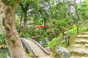 Footbridge Prints: View of red footbridge over Takueichi Pond in Shukkeien Garden