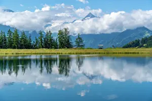 Recreational Prints: View of reflection of mountains and clouds in Plettsaukopf Reservoir on a sunny day