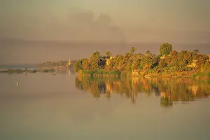 Silhouettes Prints: View of reflections in the Nile River at dawn at Al Daba Eya near Luxor
