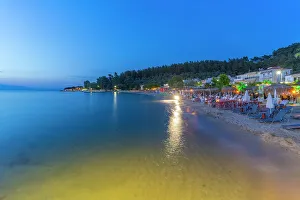 Sea View Prints: View of restaurant on beach at dusk