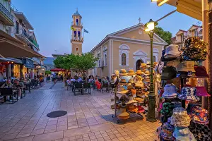 Eateries Prints: View of restaurant and Church of Agios Spiridon in Argostoli at dusk