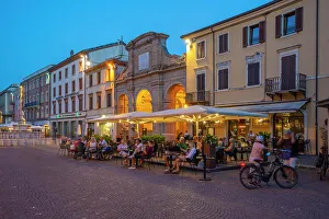 Rimini Prints: View of restaurant in Piazza Cavour in Rimini at dusk