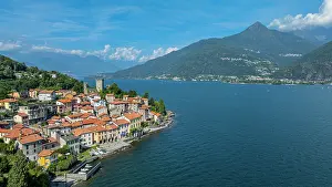 Lakeside Prints: View of Rezzonico on Lake Como with mountains and blue sky in the background