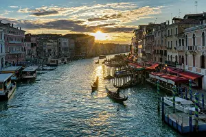 Boat Ride Prints: View from Rialto Bridge with colorful houses and the Grand Canal with traditional gondola boats at sunset