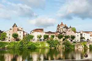 Riverside Prints: View of river bank and buildings in Cahors near Lot River in southwest France during daytime
