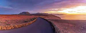 Las Palmas Prints: View of road and volcanic coastline from Mirador del Rio at sunset
