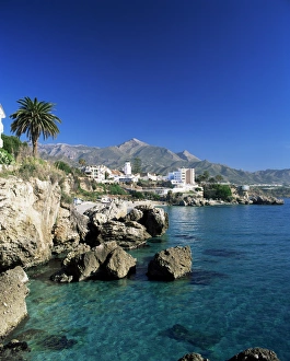 Images Dated 16th January 2000: View along rock coast to town and mountains