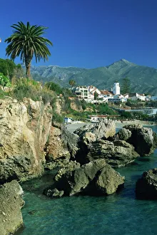 Andalusia Prints: View along rocky coast to town of Nerja and mountains