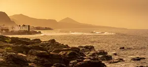 Gran Canaria Prints: View of rocky coastline and Atlantic sea at sunset near El Pagador