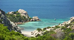 Coastal Views Prints: View from rocky hillside over the calm turquoise waters of Cala Napoletana