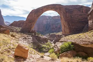 View across rocky landscape to Rainbow Bridge National Monument