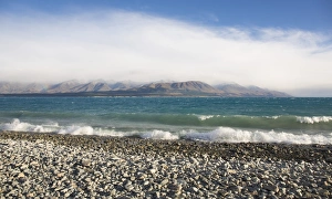 Canterbury Prints: View from rocky shoreline across the stormy waters of Lake Pukaki