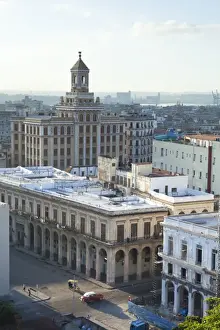 Traditionally Cuban Prints: View over rooftops of Havana towards The Bacardi Building from the 9th floor restaurant of Hotel Seville