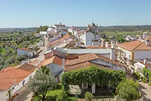 Alentejo Prints: View over rooftops of whitewashed houses and streets in the small rural settlement village of Terena