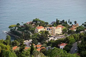 Roofs Prints: View from Roquebrune-Cap-Martin overlooking homes and coastline by the water in southeast France