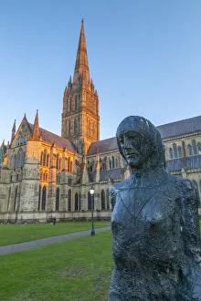 View of Salisbury Cathedral and statue at sunset, Salisbury, Wiltshire, England