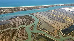 Channel Prints: View of saltpans and waterways near the coast in Algarve, Portugal during daylight hours