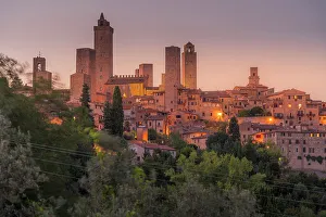 View of San Gimignano skyline at dusk, San Gimignano, UNESCO World Heritage Site, Province of Siena, Tuscany, Italy, Europe