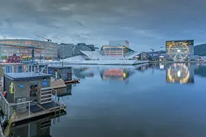 Saunas Prints: View of saunas, Oslo Opera House and Munch Museum reflecting in harbour on cloudy evening