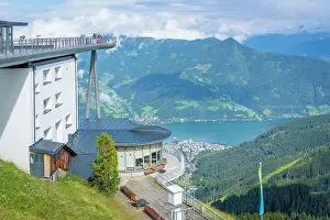 Range Prints: View from Schmittenhohebahn top station showing Zell am See and surrounding mountains on a sunny day in Austria