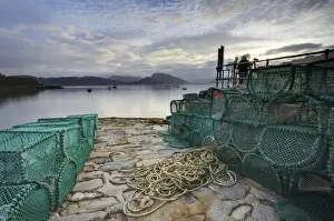 Images Dated 11th September 2009: View out to sea from stone slipway at dawn, with lobster pots and ropes in foreground