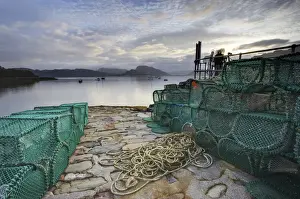 Fishing Prints: View out to sea from stone slipway at dawn, with lobster pots and ropes in foreground