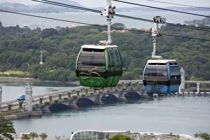 View of Sentosa Island cable car and road bridge across