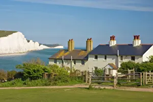 Cottage Prints: View of The Seven Sisters cliffs, the coastguard cottages on Seaford Head