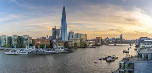 View of The Shard, HMS Belfast and River Thames from Cheval Three Quays at sunset, London