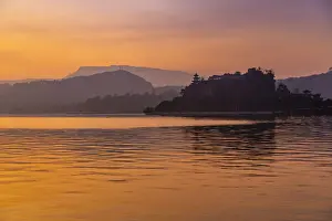 Silhouetted Prints: View of Shi Baozhai Pagoda at dusk on Yangtze River near Wanzhou, Chongqing, People s