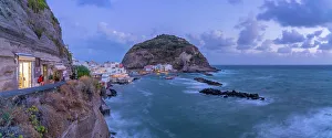 Beachfront Prints: View of shop and town in Sant'Angelo at dusk