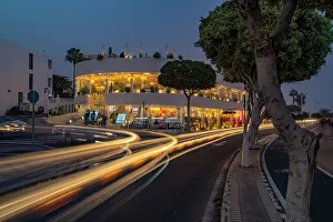 Light Trail Prints: View of shops and bars at dusk