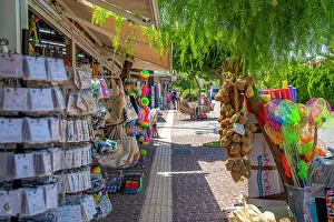 Footpath Prints: View of shops in Skala, Skala, Kefalonia, Ionian Islands, Greek Islands, Greece, Europe