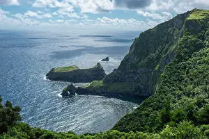 Natural Arch Prints: View of the shore from Miradouro do Ilheu Furado with a natural arch in the sea