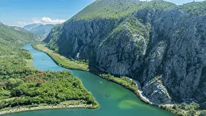 Watercraft Prints: View shows Cetina gorge and river with green banks and steep cliffs in Croatia