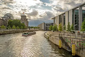 Reichstag Prints: View of sightseeing cruise boat on River Spree and the Reichstag (German Parliament building)